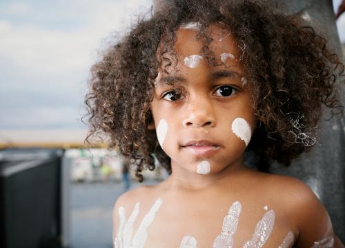 Young Aboriginal Boy with Traditional Body Paint - Australian Stock Image
