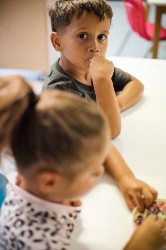 Young Aboriginal girl and boy at preschool - Australian Stock Image