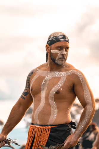 Young Aboriginal male looking into distance behind - Australian Stock Image