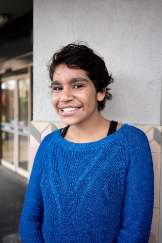 Young Aboriginal Woman Looking at Viewer - Australian Stock Image