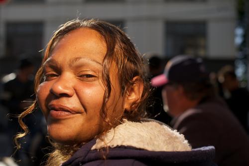 Young Aboriginal Woman Looking Back over her Shoulder - Australian Stock Image