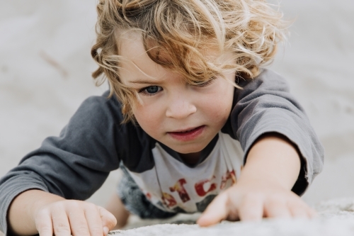 Young boy climbing - Australian Stock Image
