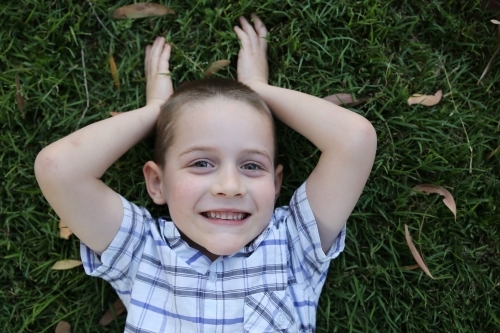 Young boy pretending to be bunny rabbit - Australian Stock Image
