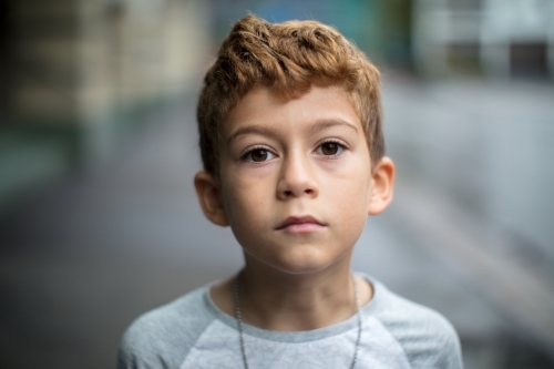 Young boy staring into the camera