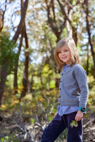 Image Of Portrait Of A Seven Year Old Boy With Long Hair Outside