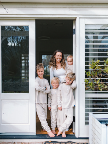 Young boys with mum standing in the doorway - Australian Stock Image
