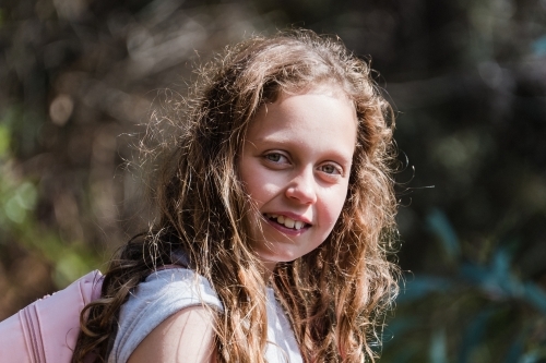 Young girl adventurer looks at camera. - Australian Stock Image