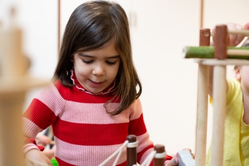 Young girl learning at pre-school - Australian Stock Image