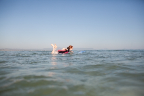 Young girl learning to surf - Australian Stock Image