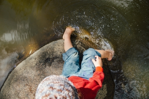Young girl playing at a lake - Australian Stock Image