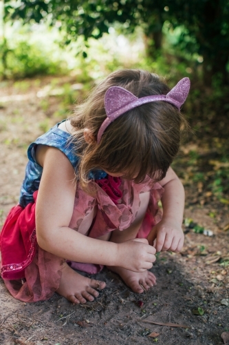 Young girl playing in backyard - Australian Stock Image
