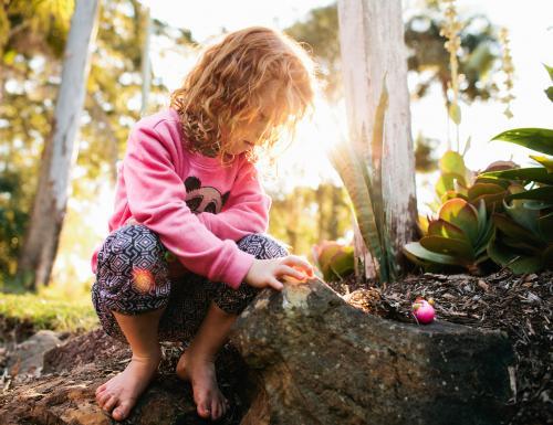 Young girl playing in the dirt - Australian Stock Image