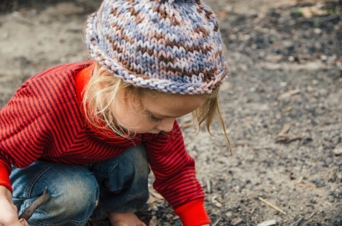 Young girl playing outdoors - Australian Stock Image