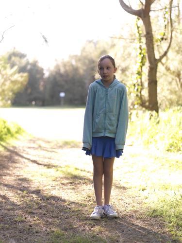 Young girl standing on a bush track - Australian Stock Image