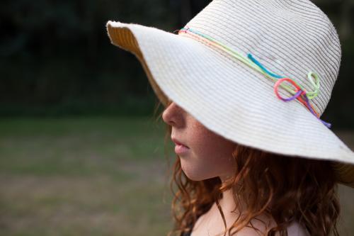 Young girl wearing a floppy hat - Australian Stock Image