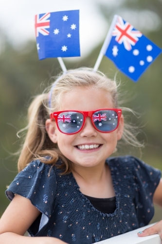 Young girl with Australian flags and sunglasses - Australian Stock Image