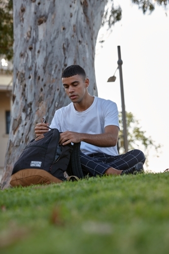 Young Indigenous Australian man enjoying time outdoors - Australian Stock Image