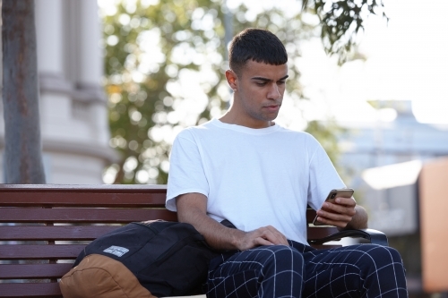 Young Indigenous Australian man enjoying time outdoors - Australian Stock Image