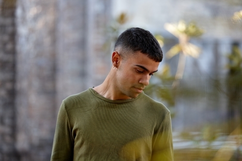 Young Indigenous Australian man enjoying time outdoors - Australian Stock Image