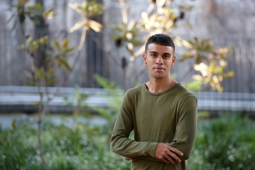 Young Indigenous Australian man enjoying time outdoors - Australian Stock Image