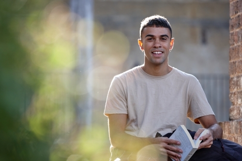 Young Indigenous Australian man enjoying time outdoors - Australian Stock Image