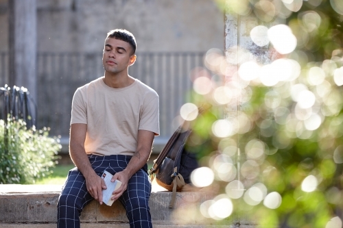 Young Indigenous Australian man enjoying time outdoors - Australian Stock Image