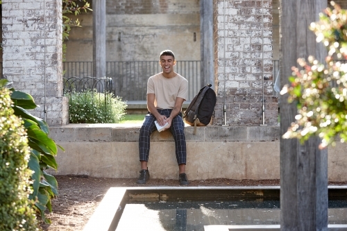 Young Indigenous Australian man enjoying time outdoors - Australian Stock Image
