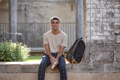 Young Indigenous Australian man enjoying time outdoors - Australian Stock Image