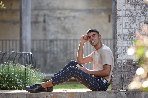 Young Indigenous Australian man enjoying time outdoors - Australian Stock Image