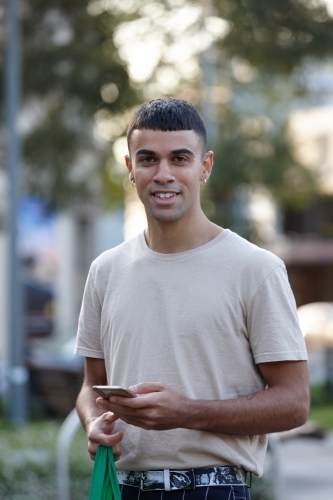 Young Indigenous Australian man enjoying time outdoors - Australian Stock Image