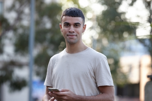 Young Indigenous Australian man enjoying time outdoors - Australian Stock Image