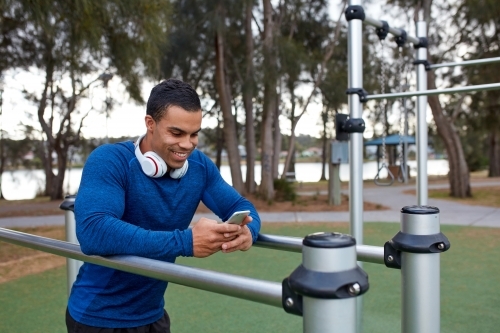 Young Indigenous man working out at park - Australian Stock Image