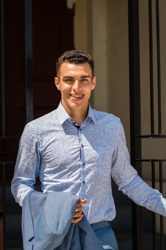 young man leaving house - Australian Stock Image