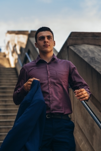 young man on stairs - Australian Stock Image
