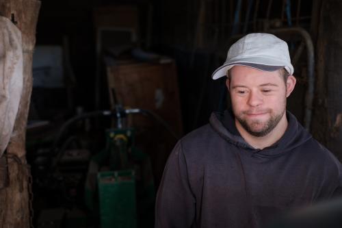 Young Man smiling in a Shed - Australian Stock Image