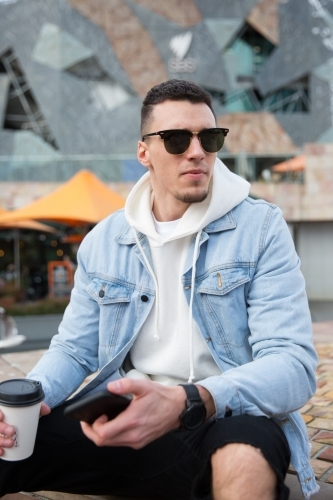 Young Man Waiting in Federation Square - Australian Stock Image