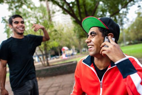 Young Men in a Park having a Joke - Australian Stock Image