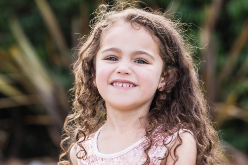 Young mixed race aboriginal caucasian girl smiling - Australian Stock Image