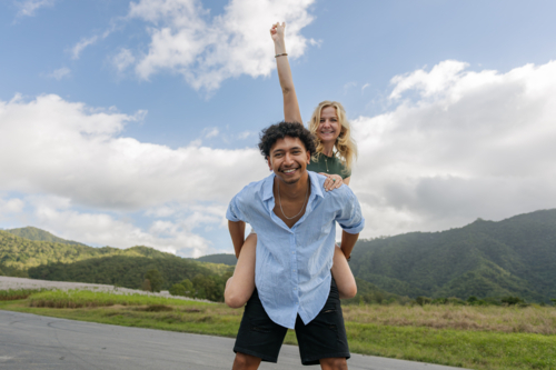 Young mixed race couple having fun during a piggyback ride - Australian Stock Image