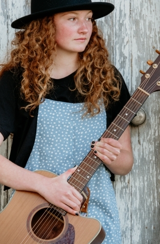 Young teenage girl with guitar. - Australian Stock Image