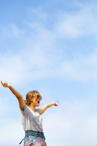Young woman against sky background