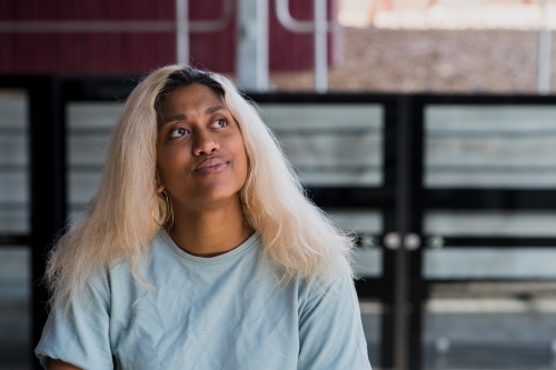 young woman at the train station - Australian Stock Image
