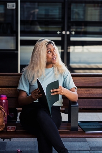 young woman at the train station - Australian Stock Image