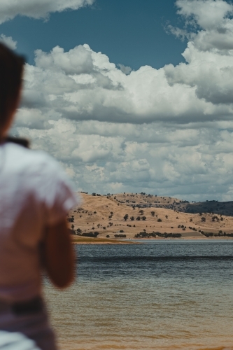 Young woman enjoying mountain views over Lake Hume - Australian Stock Image