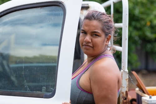 young woman getting into ute - Australian Stock Image