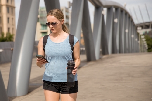 Young Woman in Sportswear Walking to Melbourne City - Australian Stock Image