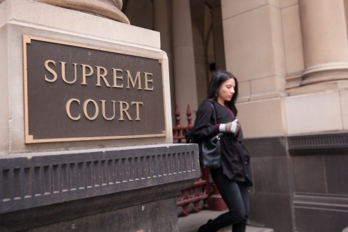 Young Woman Leaving Supreme Court - Australian Stock Image