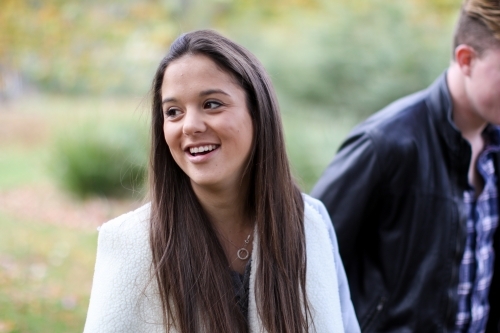 Young woman looking away laughing and smiling - Australian Stock Image