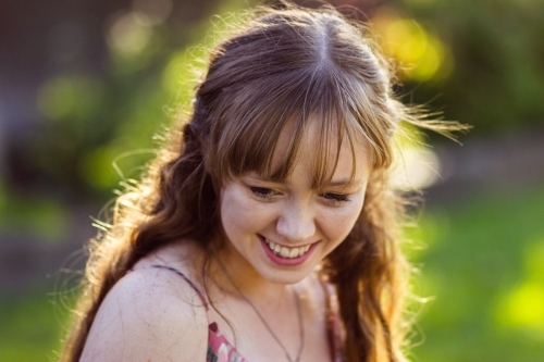 Young woman looking down - Australian Stock Image