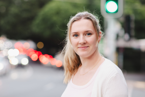 young woman portrait in urban street setting - Australian Stock Image